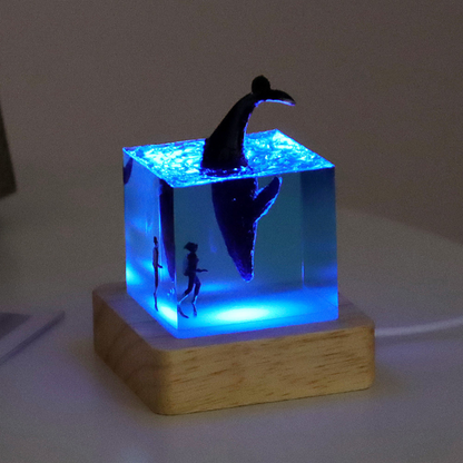 Handmade resin drip art ornament featuring ocean whales