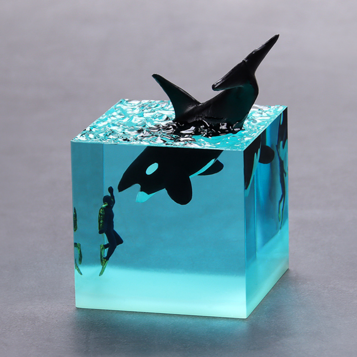 Handmade resin drip art ornament featuring ocean whales