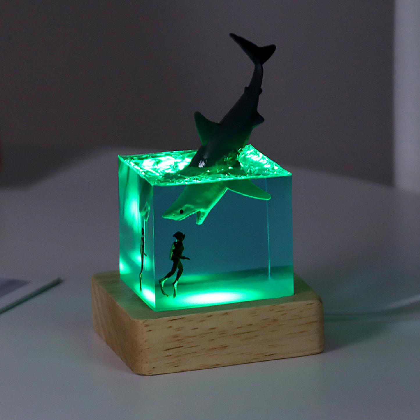 Handmade resin drip art ornament featuring ocean whales