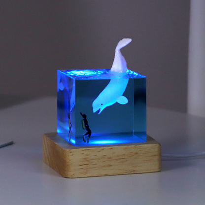 Handmade resin drip art ornament featuring ocean whales